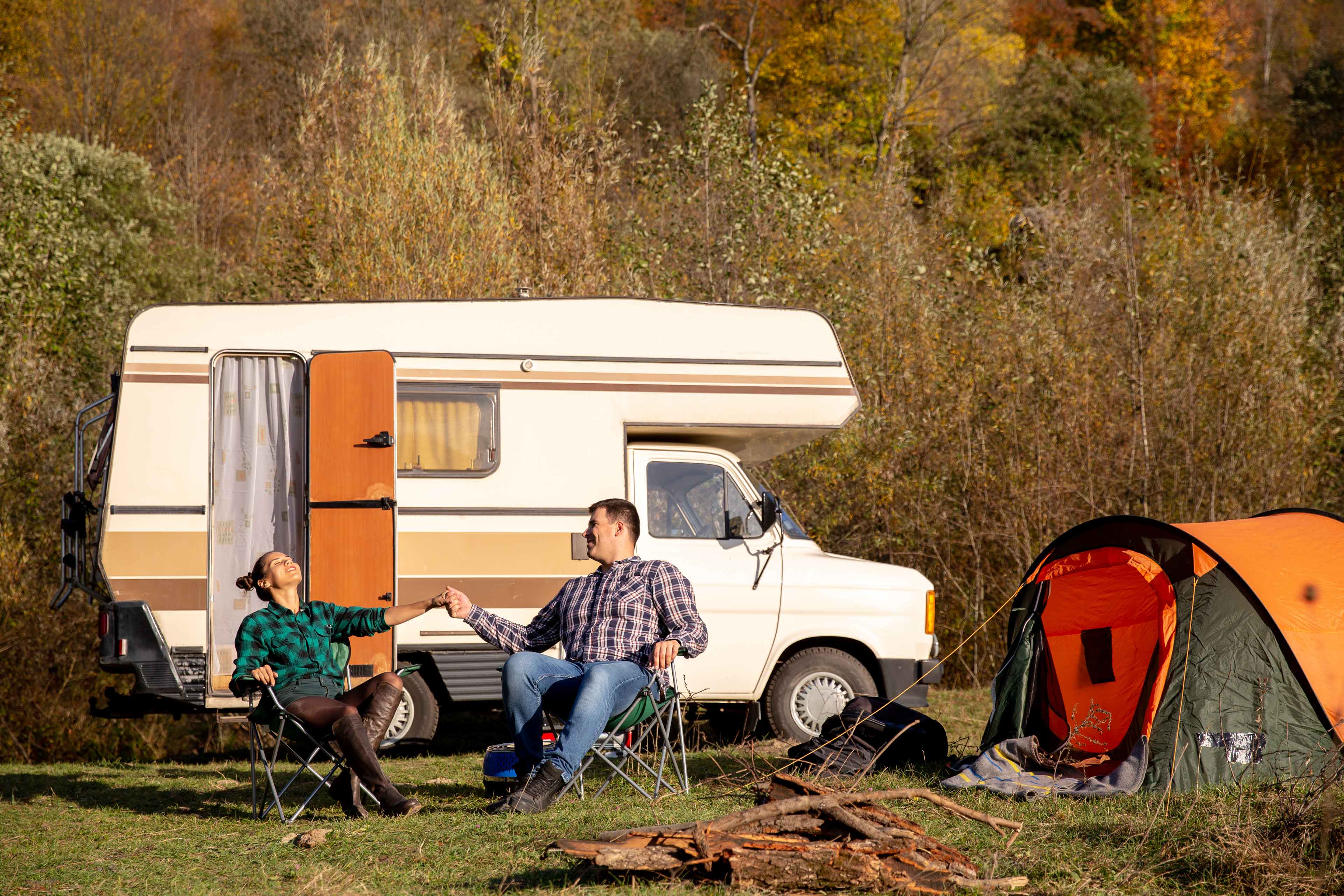 couple love sitting camping chairs enjoying beautiful weather romantic atmosphere