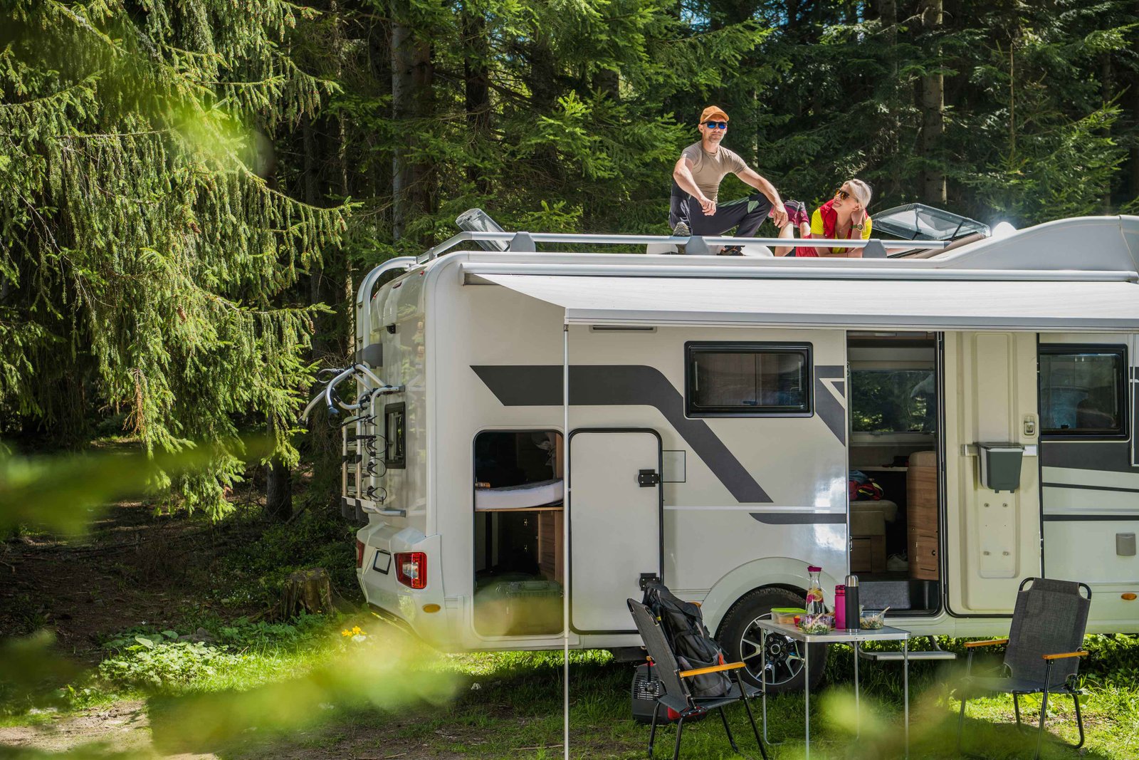 happy family relaxing roof their rv