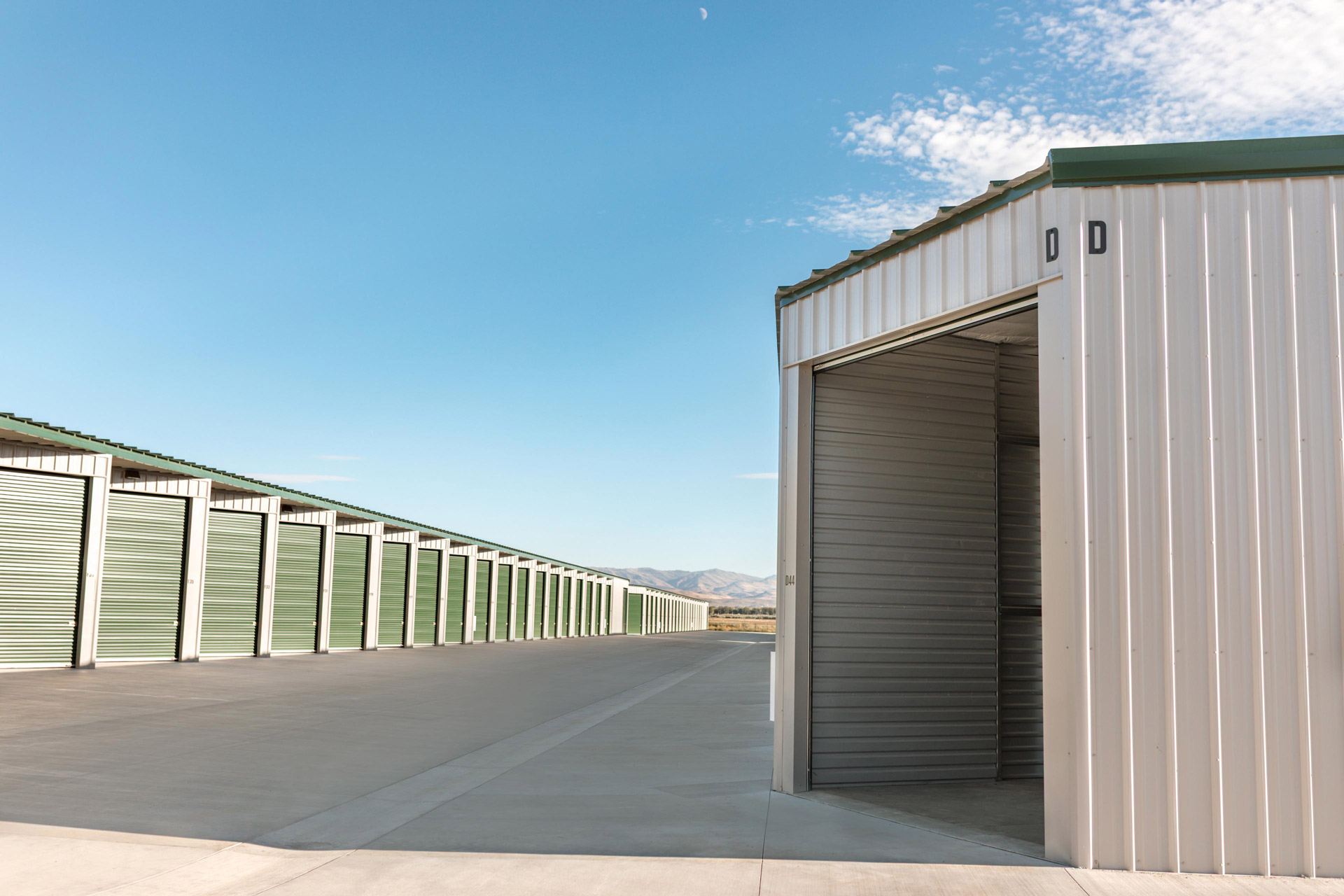 an open storage unit near a row of closed storage units 5