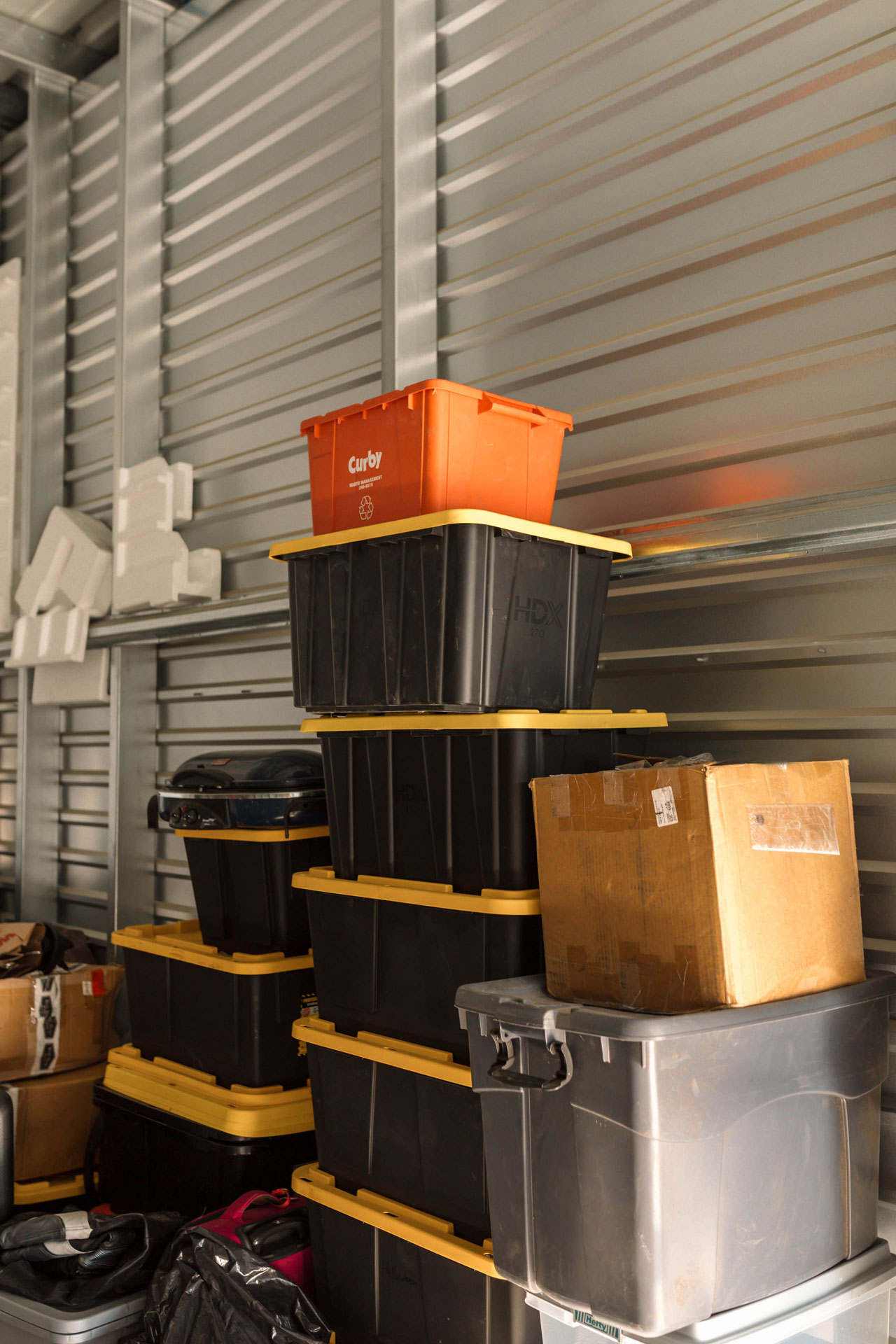 boxes and storage bins inside of a storage unit 4